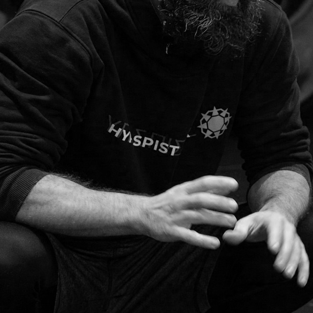Hypaspist black and white photograph of Tom Hepburn wearing the Hypaspist hoodie