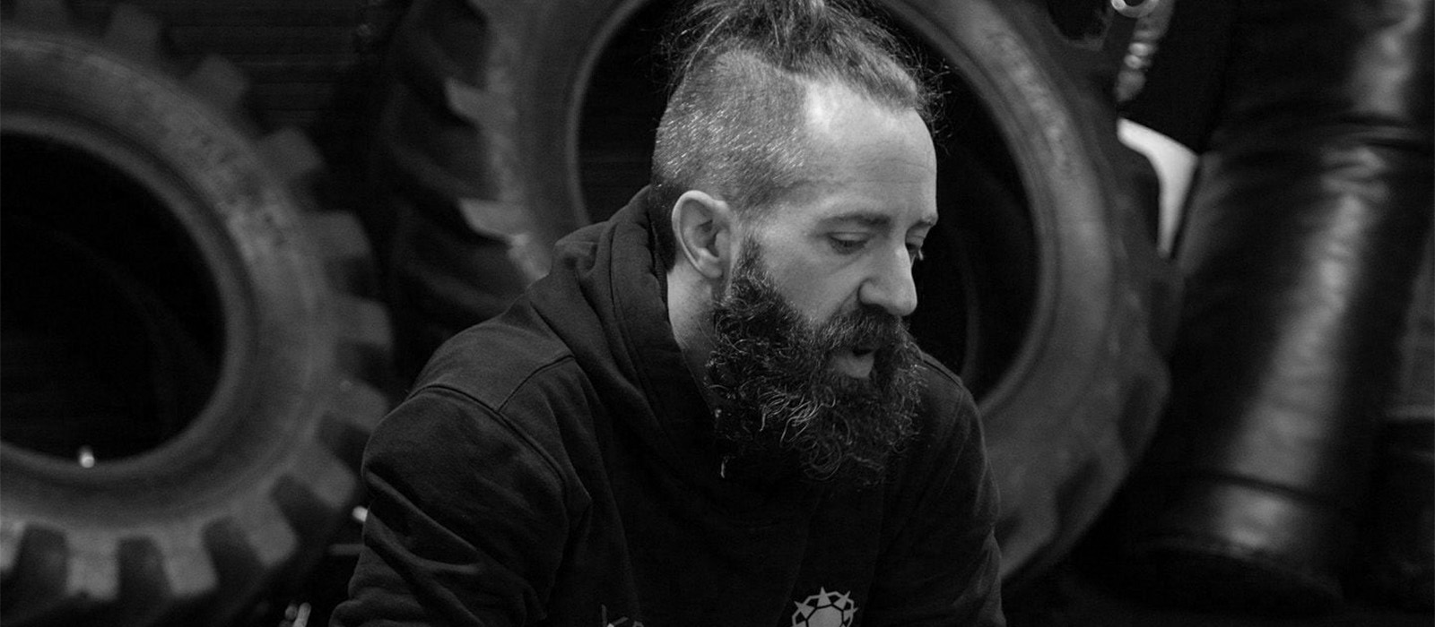 Hypaspist black and white photograph of JHead Coach Tom Hepburn